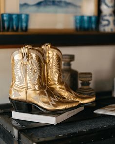 Maggie, our five-star darling, is the epitome of traditional western meets fashion. Elevated in our best-selling gold metallic, Maggie isn't just a cowboy boot; she's your go-to for every occasion. Her extra deep topline offers a super flattering silhouette that's endlessly versatile. Dress her up or dress her down—either way, Maggie promises to keep you looking fabulous from dawn till dusk. This boot is part of MC Personalization and can customize the Ear Pulls and/or add an interior Message Bo Western Gold Boots For Rodeo, Gold Snip Toe Boots For Fall, Gold Snip Toe Boots For Rodeo, Gold Leather Western Boots, Miron Crosby, Women's Cowboy Boots, Wedding Boots, Star Darlings, Gold Luxury