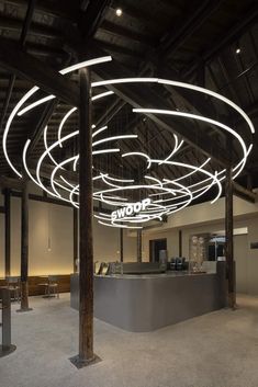 the interior of an office building with circular lights