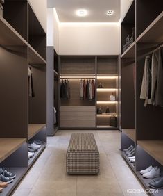 an empty walk in closet with clothes and shoes