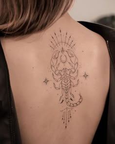 a woman with a tattoo on her back