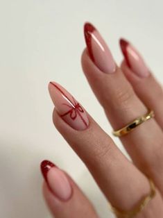 22 Trendy Red French Tip Nails to Keep Your Winter Look Fresh | Everygirl Edit French Tip Nails Gel Almond, Red Winter Nails Almond, Christmas Nails Aesthetic Red, Winter Nail Almond, Red Christmas Nail Designs 2024, Christmas Nails Red Almond, French Tip Xmas Nails, Cute Christmas Nails Almond, Red Christmas French Tip Nails