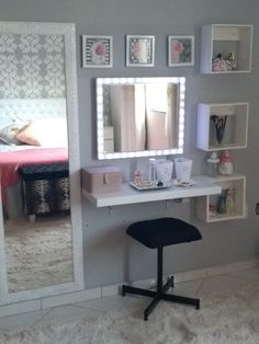 a white desk topped with a mirror and lights