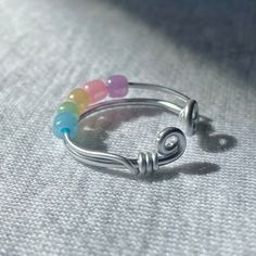 a close up of a ring with beads on it