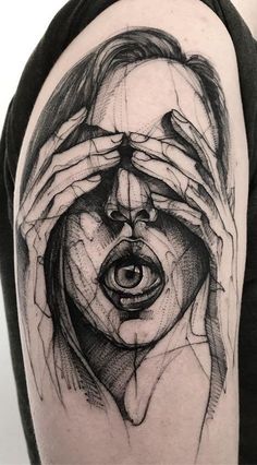 a man's arm with a black and white drawing on it