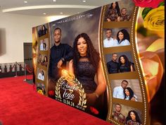 a red carpeted area with an advertisement for the film, and two people standing in front of it