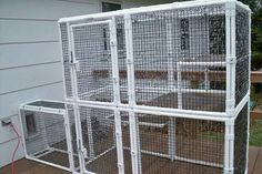 an outdoor cage is set up outside on the deck