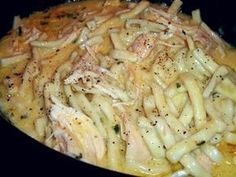 pasta with chicken and parmesan cheese in a skillet