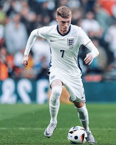 a male soccer player in action on the field