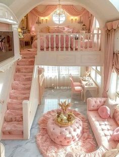 a room with pink furniture and stairs in it