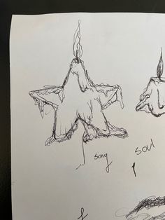 two drawings of an upside down star and another drawing of a candle with the word sorry written on it