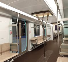 the interior of a train car with empty seats and no one in it or on the other side