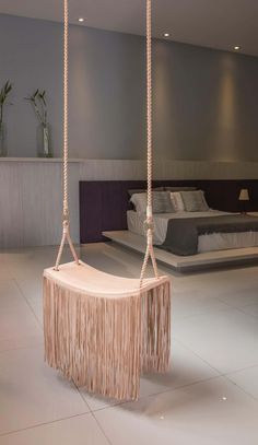 a bed room with two beds and a swing