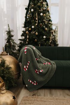 a living room with a christmas tree in the corner