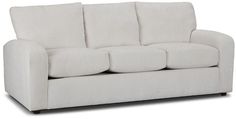 a white couch sitting on top of a wooden floor