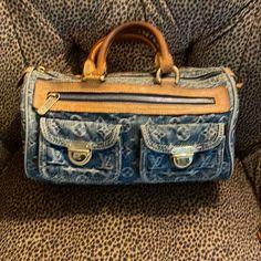 Rare Lv Blue Denim Bag. Rolled Handles. Lv Monogram Leather Trim Embellishment Brass Hardware Zip Closure At Top One Zip Pocket In Front And Two Pockets In Front With Brass Closures One Pocket Inside Alcantra Lining Depth 5.75” Width 11.25” Height 7” Handle Drop 3.75” Note Serial Number In Last Picture Made In France Louis Vuitton Denim Bag Outfit, Denim Louis Vuitton, Lv Monogram, Monogrammed Leather, Denim Bag, Better Love, Brass Hardware, Fun Bags, Leather Trim