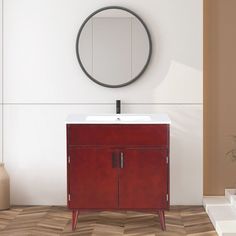 a white sink sitting under a mirror next to a wall mounted faucet in a bathroom