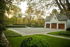 a house with a tennis court in the front yard