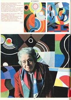 an old woman is standing in front of colorful art and design on the cover of a magazine