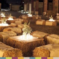 hay bales with flowers and candles on them