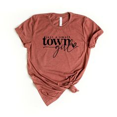 Looking for a cute versatile top to wear this summer? Make sure to grab one of our Take Me To Nashville Winged Guitar garment dyed graphic tees! This soft and comfortable graphic tee is the perfect top for any outfit. It can be paired with biker shorts, jeans, or even a simple skirt/dress! This tee is true-to-size, so be sure to order your regular t-shirt size! If you are looking for a more oversized look, make sure to size up! Htv Ideas, Country Tees, Simple Skirt, Western Graphic Tees, Nashville Outfits, Small Town Girl, Country Shirts, Create Shirts, Simple Shirts