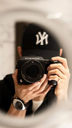 a person taking a photo with a camera