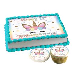 a birthday cake and two cupcakes are shown