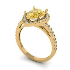 a yellow diamond engagement ring with diamonds on the band and side stones set in 18k gold