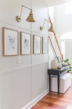 an entryway with pictures on the wall and text overlay that says easy diy board and batten