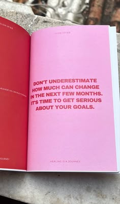 a pink book with the words don't underestimate how much can change in the next few months, it's about your goals