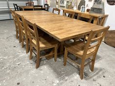 a large wooden table with six chairs around it