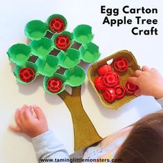 an egg carton apple tree craft for toddlers to make with the help of their mother