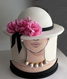 a white hat with pink flowers on top