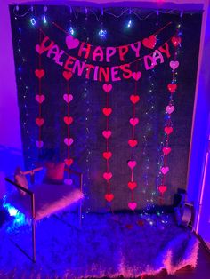 a valentine's day backdrop with hearts hanging from the ceiling and lights on the wall