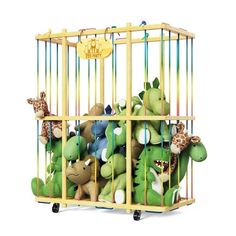 the stuffed animals are in the cage together