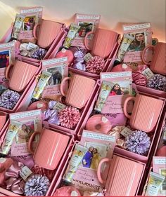 many pink mugs with pictures and pine cones in them are stacked on top of each other