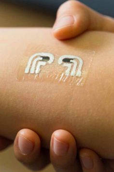 a person's arm with a sticker on it that says fpp in white