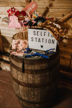 a wooden barrel filled with lots of different types of items on top of each other