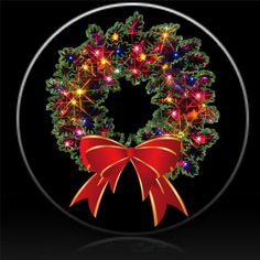 a lighted christmas wreath with red ribbon and lights on it's side, against a black background