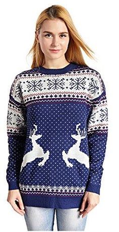 a woman wearing a sweater with deers on it