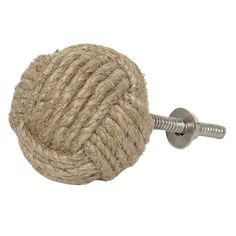 a ball of rope is attached to a metal hook on a white background with a screw in the middle