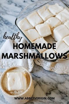 homemade marshmallows in a glass dish on a marble counter top with the words healthy homemade marshmallows