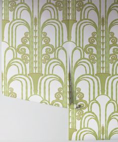 an art deco wallpaper with green and white designs