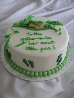 there is a cake with green decorations on the top and bottom that says, to thin mother - in - law and her sweet little paw