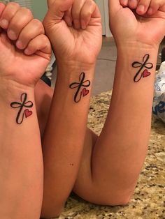 Sister Tattoo. Cross Infinity Heart. #wrist #infinity #sistertattoos… Sibling Sister Tattoos, Tattoos For 4 Cousins, Mine Tattoo Ideas, Sisters Infinity Tattoo Ideas, Sister Infinity Tattoo Ideas, Cross Infinity Tattoo, Matching Cross Tattoos, Sister From Another Mother Tattoo, Sister Tatooes