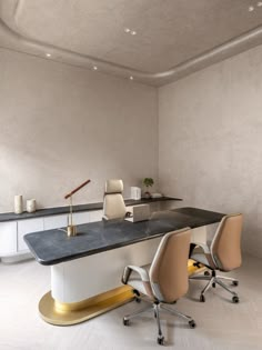 an office with two desks and chairs in it