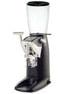 an espresso machine sitting on top of a white table