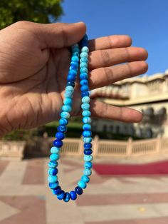 Natural Shade Blue  Round Shape Smooth Opal Beads Necklace ,7-10 mm Opal Beads, 16 Inch Strands Necklace AAA+ Quality. Gemstone  :    Opal. Color           :    Shade Blue. Size             :     7-10 mm size. Shape         :    Round Smooth Shape. Style           :    Smooth Handmade Beads.  Quality       :    AAA+ Length       :    16''  Strand.  For   :   Necklace, Jewelry Design, Craft Making, Gift, Etc.   These Are Natural Gemstones Therefore, Variation In The Shade & Quality Is Expected. Gemstone Picture Shown Are Of Actual Gemstone That You Will Receive, However, The Color & Appearance May Look Slightly Different Depending On Your Monitor Resolution & Climatic Condition. Some Imperfections Can Be Expected As Stones Are Natural. If Required, Please Ask Us To Show The Lot Image Before Hand-strung Blue Beaded Bracelets With Round Beads, Blue Hand-strung Beads For Jewelry Making, Hand-strung Blue Beaded Bracelets, Blue Spiritual Beads With Colorful Details, Blue Rondelle Beaded Bracelets With Polished Beads, Bohemian Hand-strung Blue Beads, Blue Polished Beads For Beach, Blue Rondelle Gemstone Beaded Bracelets, Blue Rondelle Beads