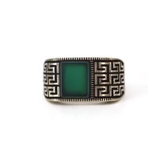 This ring is the perfect choice for men who are looking for a unique and stylish piece of jewelry. It is made of 925 silver with Green Onyx and Oriental Pattern design that is sure to stand out. The silver color is perfect for making a statement and will match any outfit.    Handmade item  Material detail  Metal: Sterling Silver with Yellow gold filled Hypoallergenic and Lead, Cadmium, and Nickel Free.  Gift wrapping available  Jewelry Pieces Made in New York Cirt USA. What is sterling silver?  Since its creation, sterling silver has been used in jewelry design by all cultures across the world. Sterling silver contains 92. 50% pure silver and is mixed with other alloys such as copper, zinc, or palladium to make it stronger and more durable overall. From a manufacturing perspective, this im Mens Silver Rings Handmade, Vintage Green Sterling Silver Signet Ring, Luxury Green Signet Ring With Polished Finish, Green Sterling Silver Gemstones With Polished Finish, Luxury Green Sterling Silver Men's Ring, Green Polished Sterling Silver Gemstones, Jewelry Rings Unique, Signet Ring Men, Bold Rings