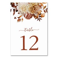 a table number with flowers on it and the numbers 12 - 22 are in red