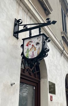 a clock mounted to the side of a building